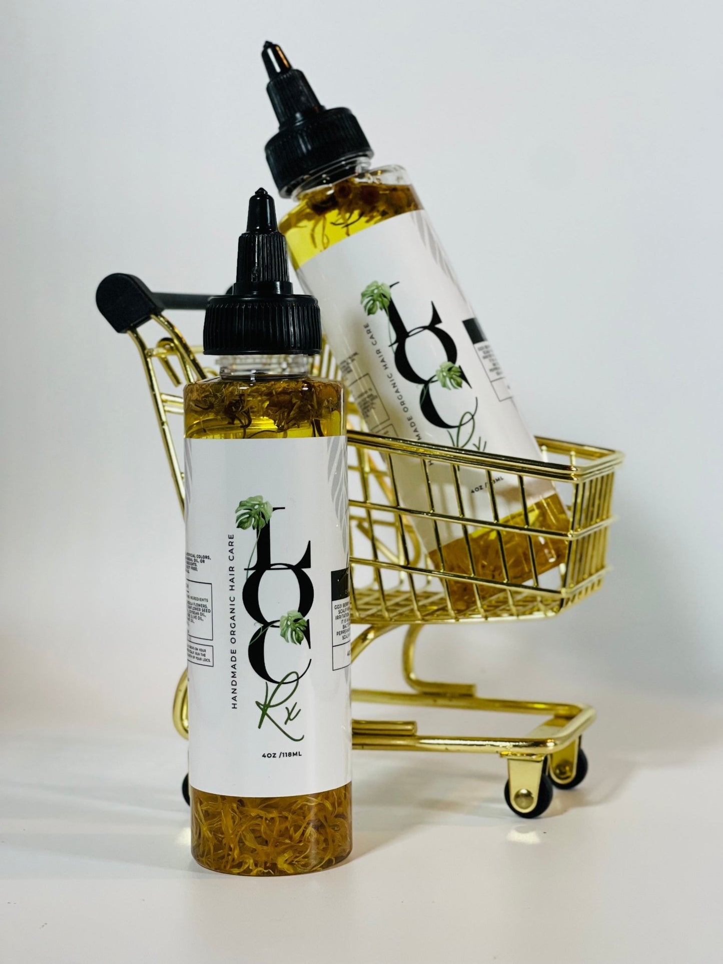 A bottle of 'Anti' Protective Anti-Itch Oil with a label that reads "soothes dry, itchy scalps and promotes a healthy scalp environment". Contains chamomile, goji berry, and calendula to hydrate dry scalps, remove dandruff, and prevent dryness and flakiness. Suitable for all hair types and textures, especially for locs, loose natural hair, braids, and protective styles.